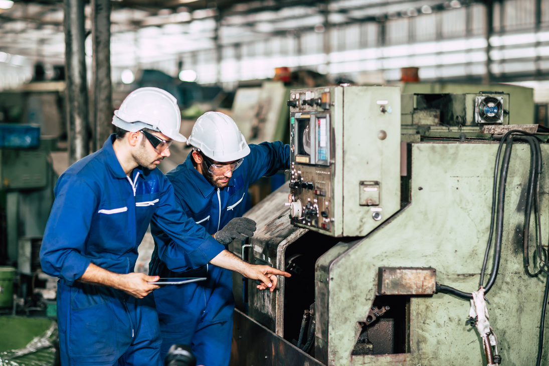 Factory machine maintenance service engineer team worker working together teamwork inspector in factory.